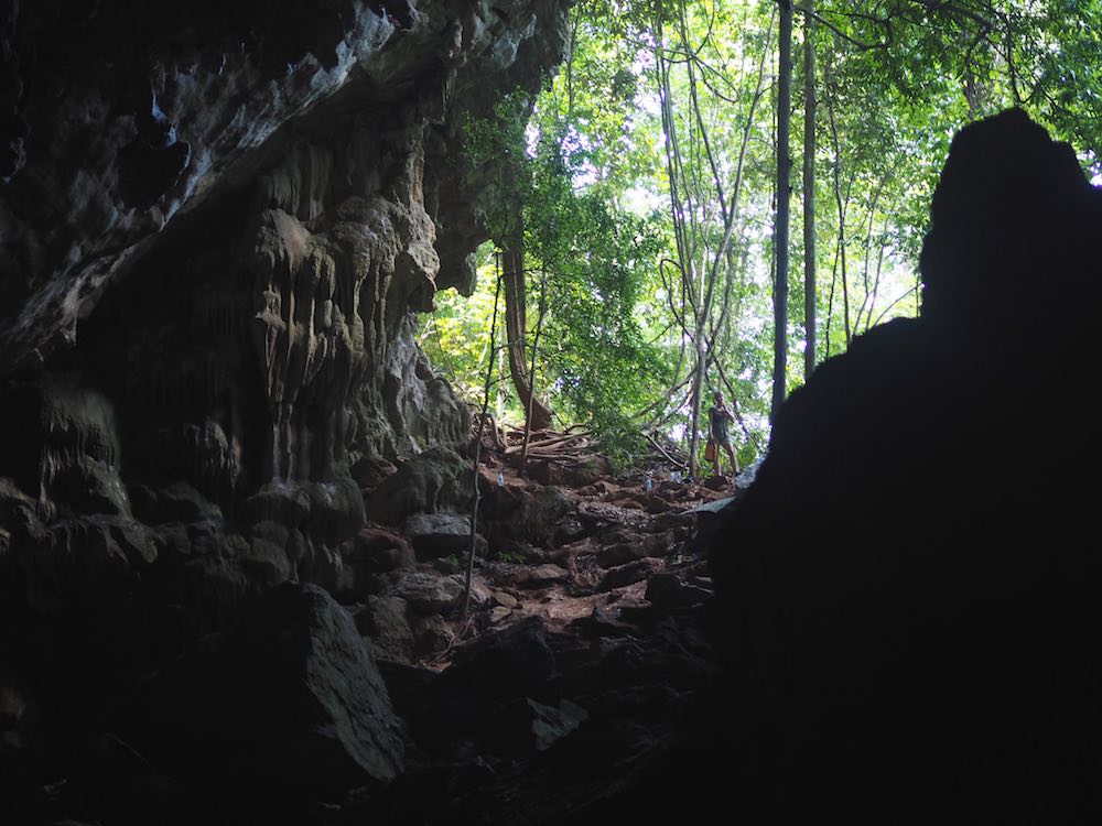 Looking up to the cave entrance
