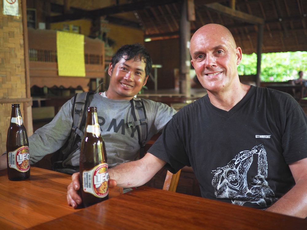 Ian and Ong share a post-trek beer