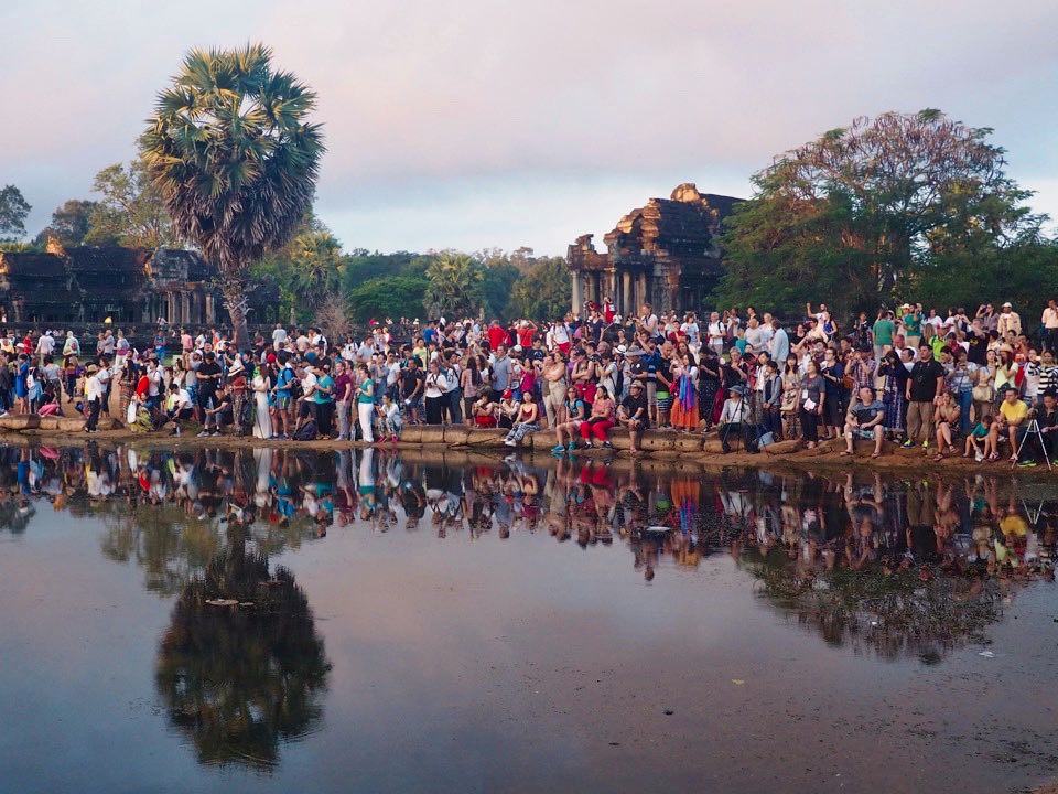The crowd gather for sunrise at Angkor Wat