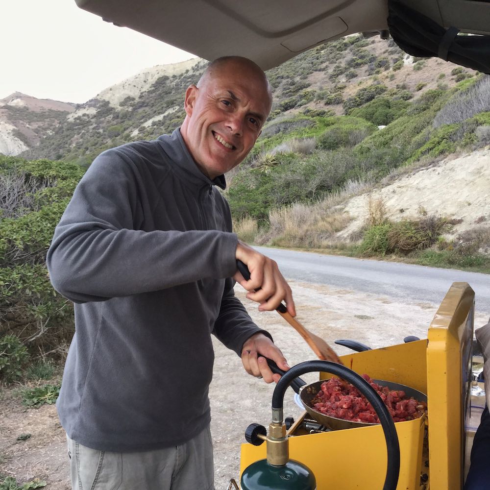 Ian cooking chilli in our camper van