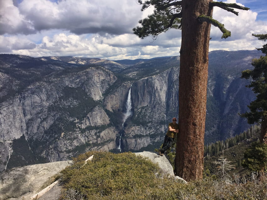 Sentinal Rock to Taft Point Loop Ian in front of view of Yosemite Falls California