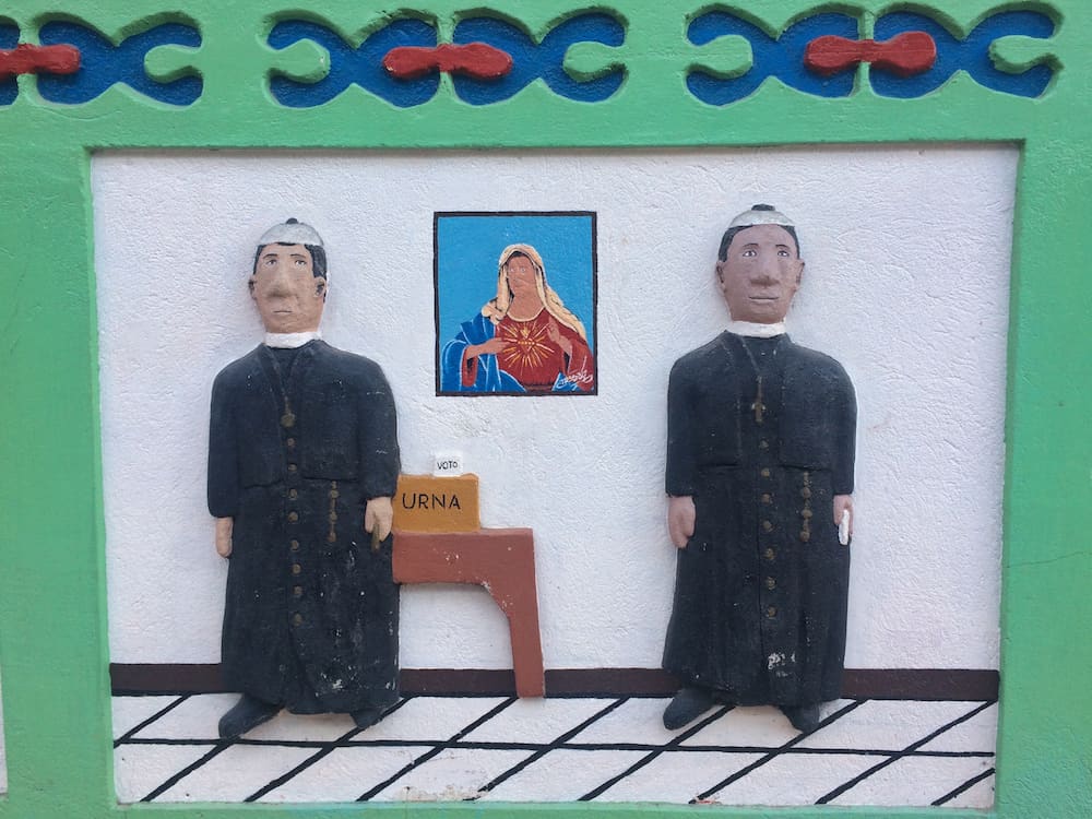 Exploring Guatape - priest zocalo