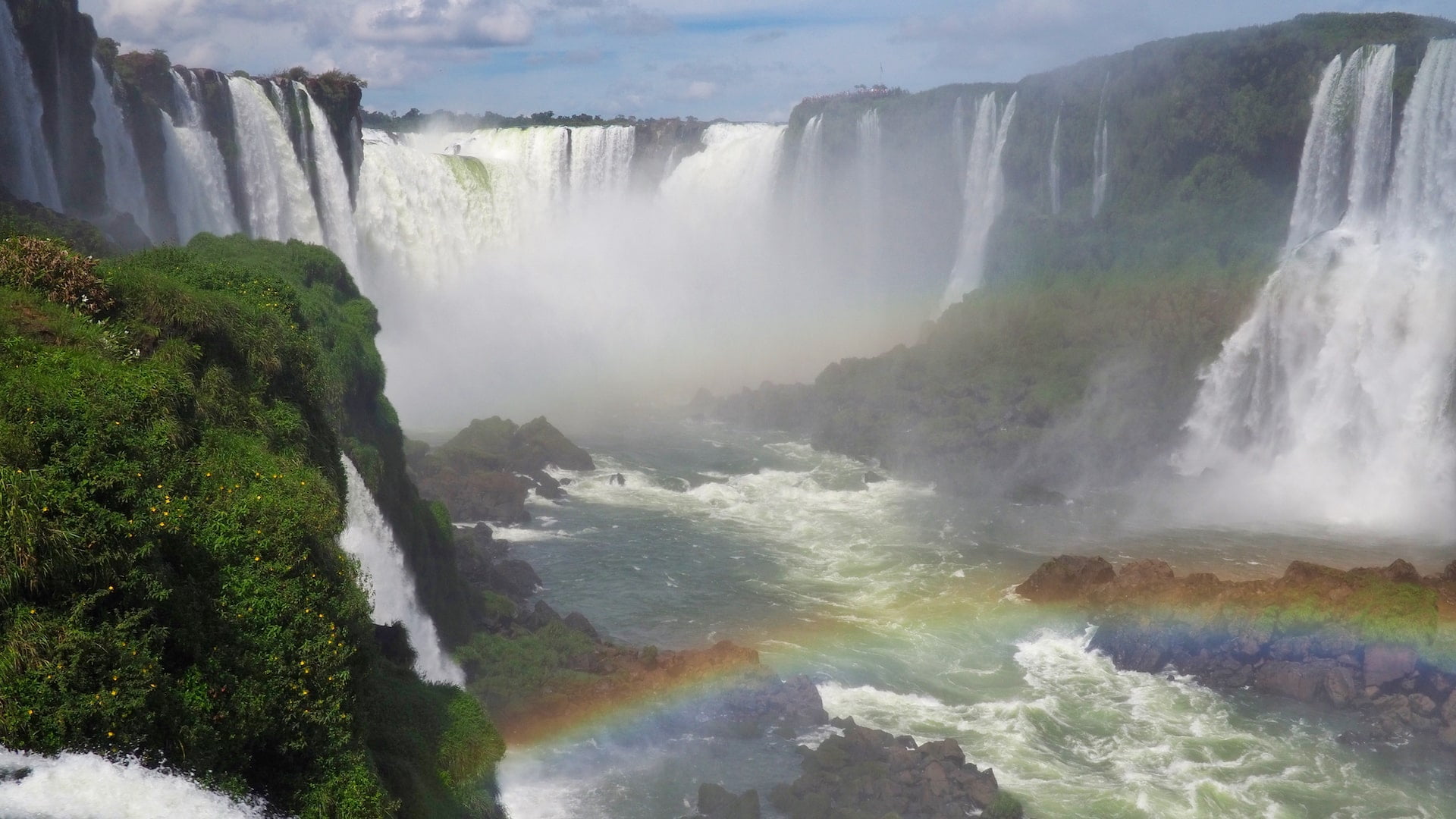 Iguacu Falls with a rainbow in front of it