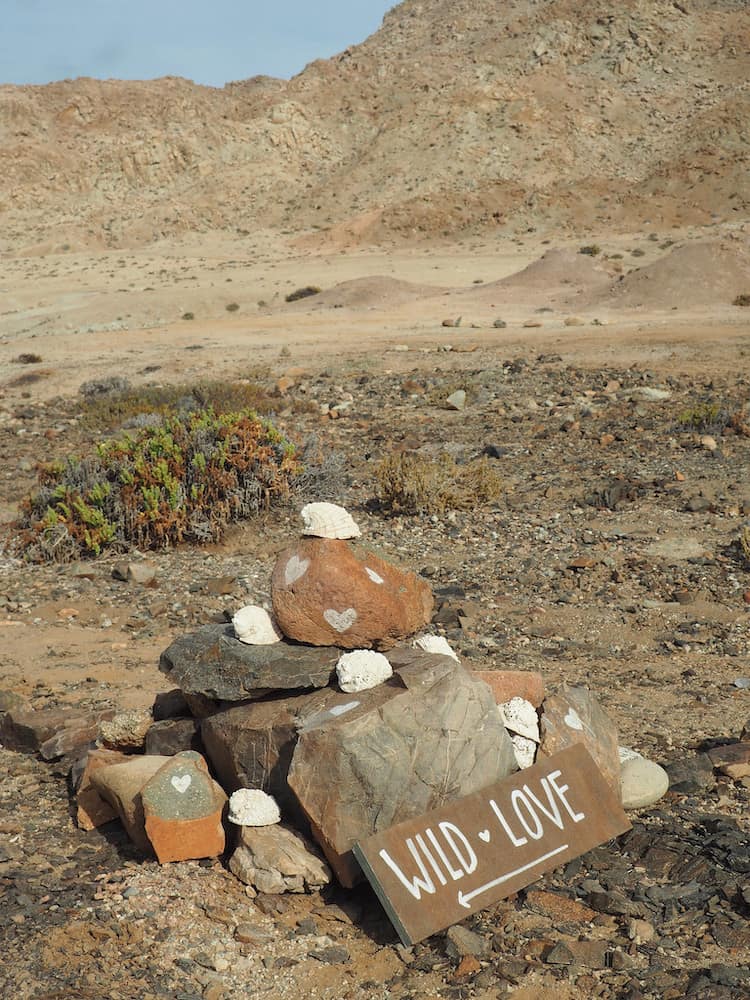 A small bundle of rocks with the words "Wild Love" inscribed on them