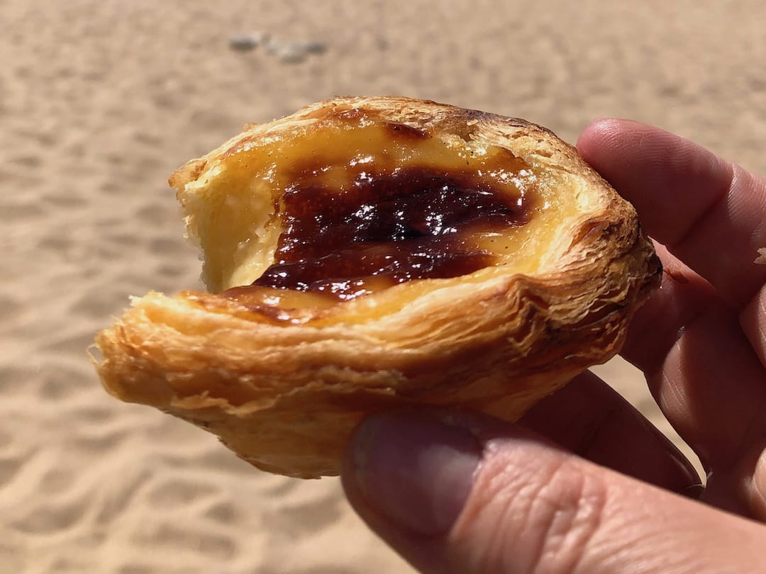 A circular pastry with a yellow filling and brown top