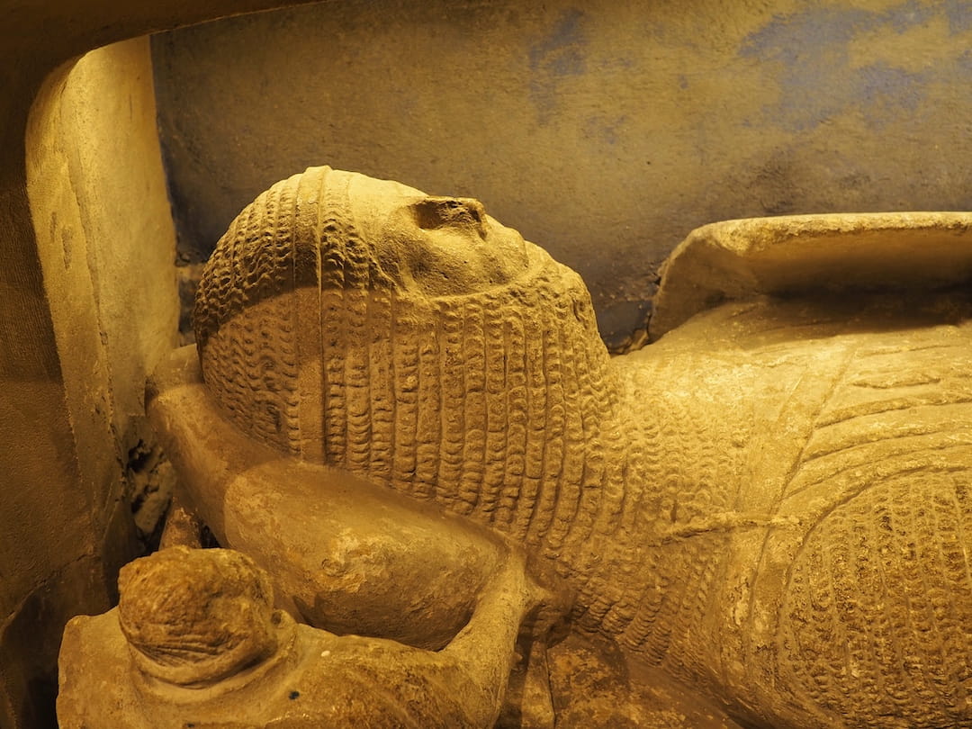 A close up of the tomb's upper body and head