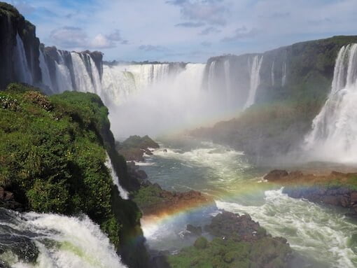A rainbow appears in front of Iguacu Falls, Brazil