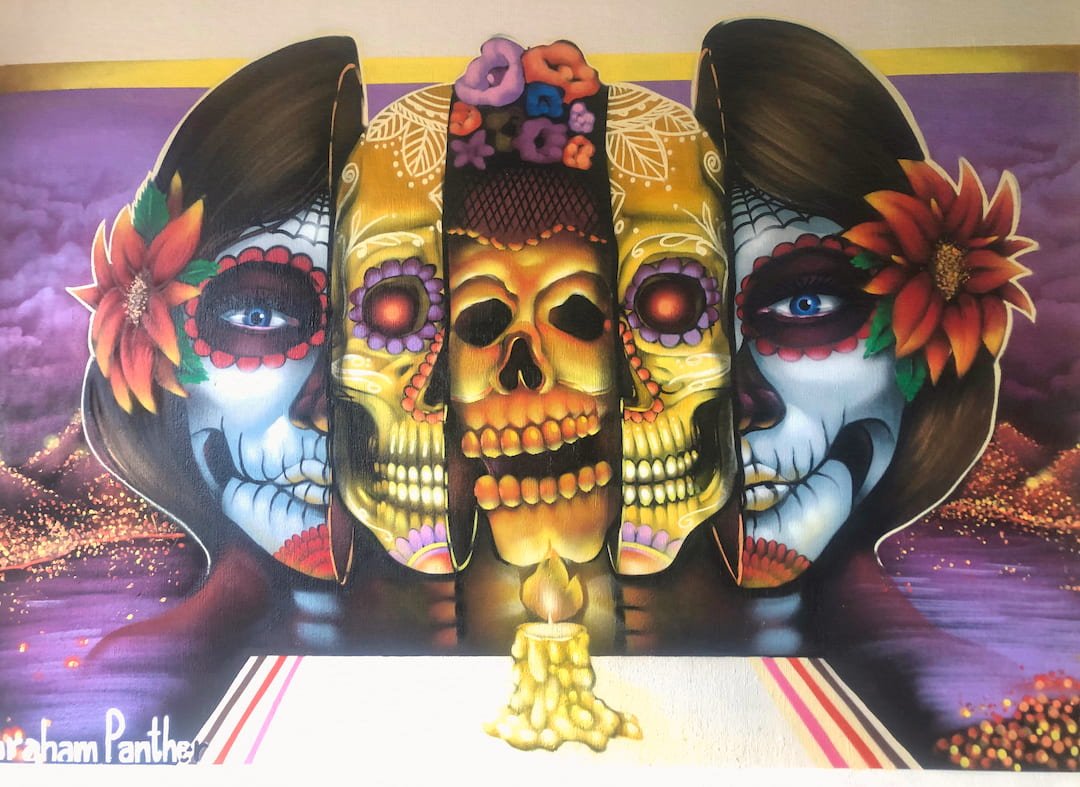 Day of the Dead faces within a mural