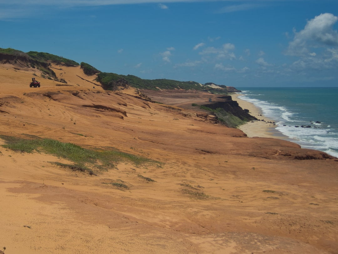 Sand dunes and buggies behind Praia das Minas - Pipa Brazil