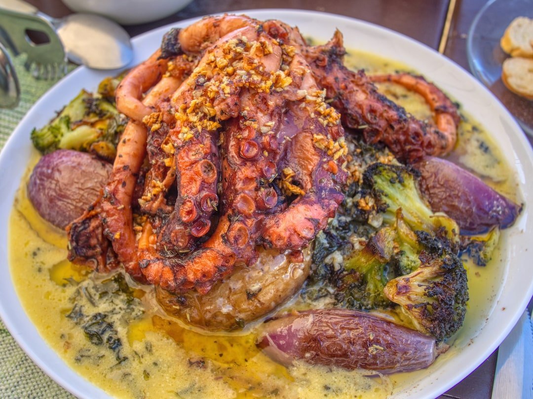 Plate of octopus in yellow sauce