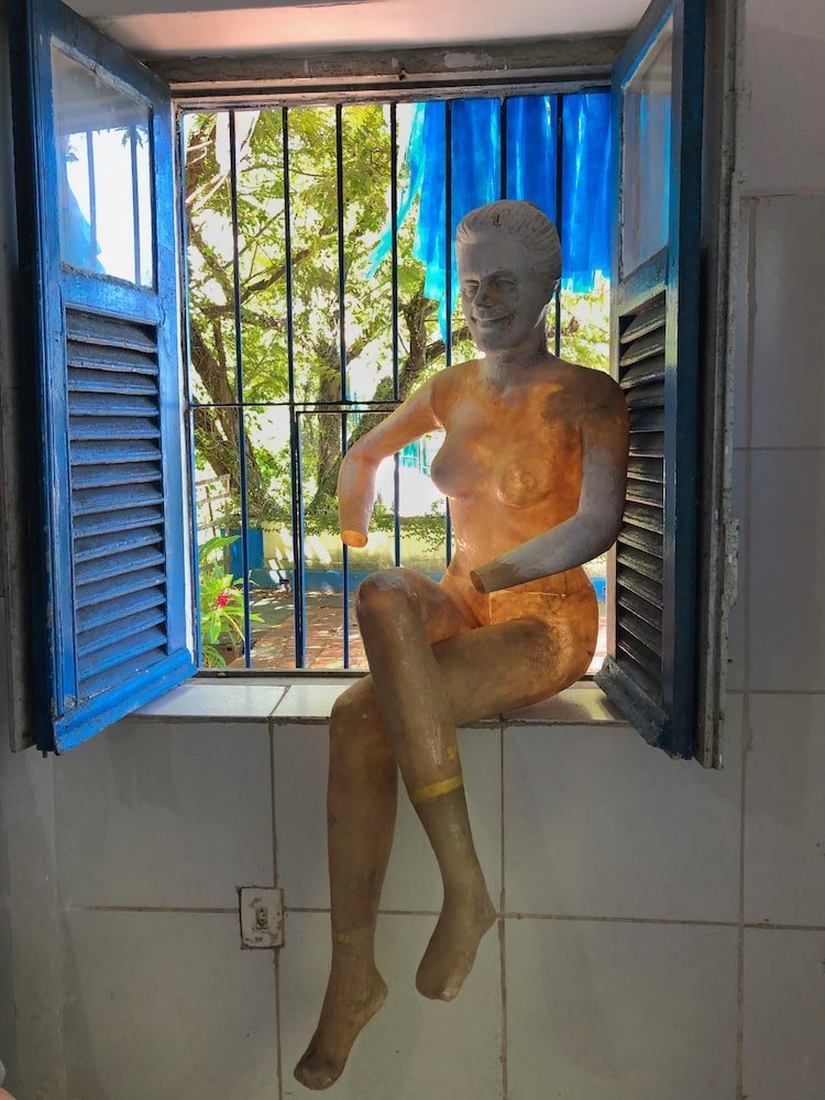 A stripped down puppet in one of the museum windows